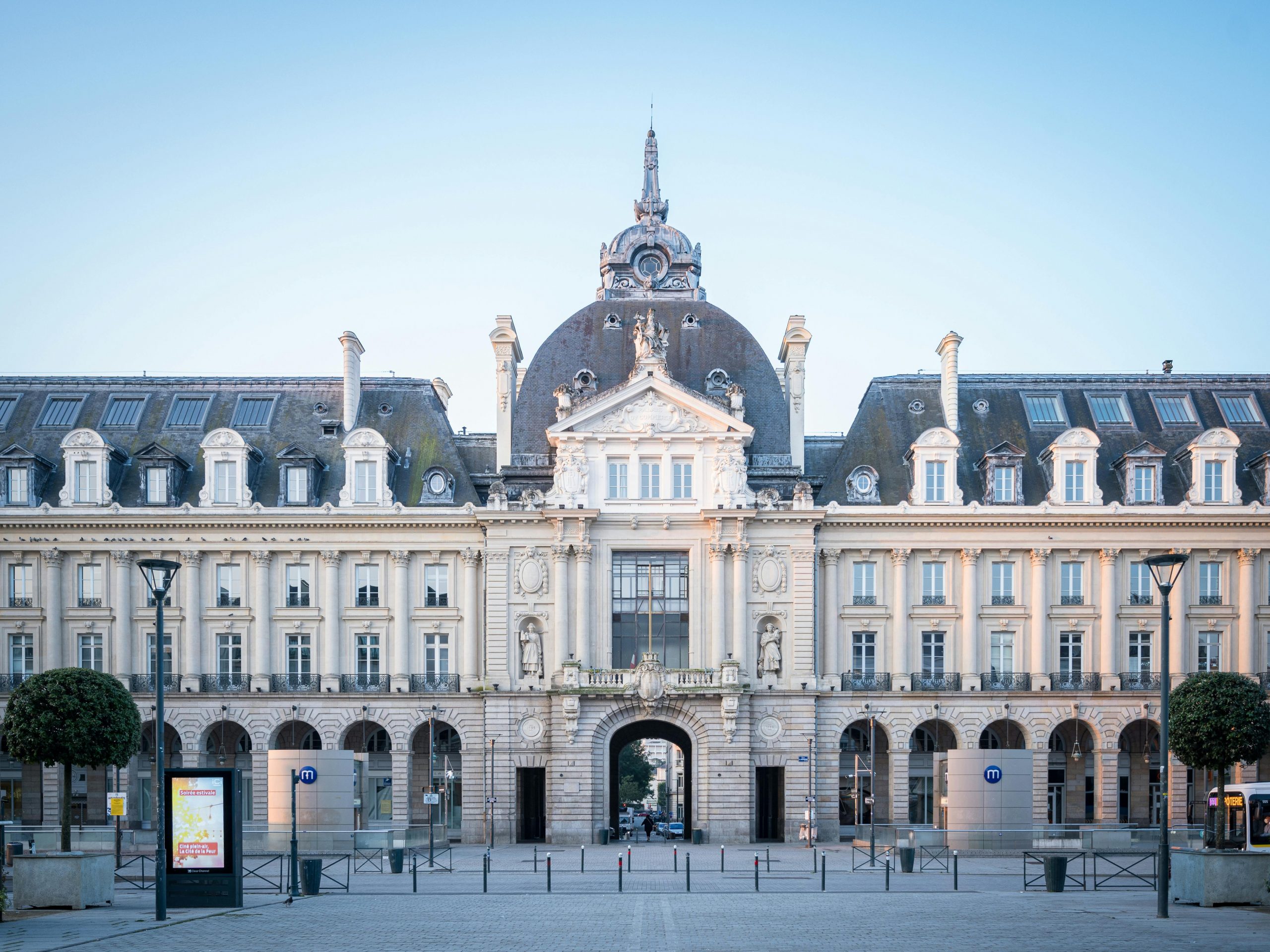 Stunning view of the Rennes City Hall with its classic baroque architecture under a clear blue sky,  location food truck